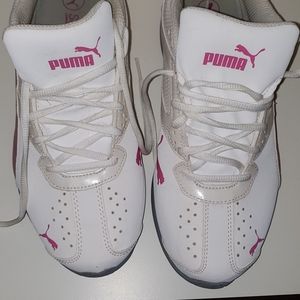 Pink and white Puma tennis shoes